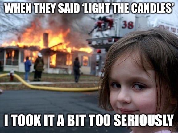Famous meme image of a girl smiling with a house fire behind her