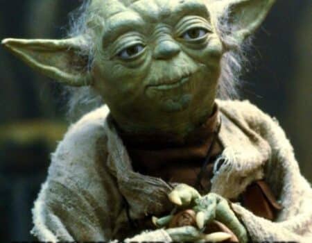 Yoda with hands folded, saying 'Happy birthday to you. May your cake be, and your age a secret it shall remain.'