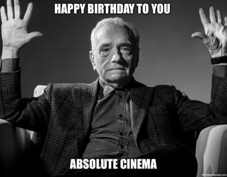 A serious man raises his hands with the text 'Happy Birthday To You Absolute Cinema.'