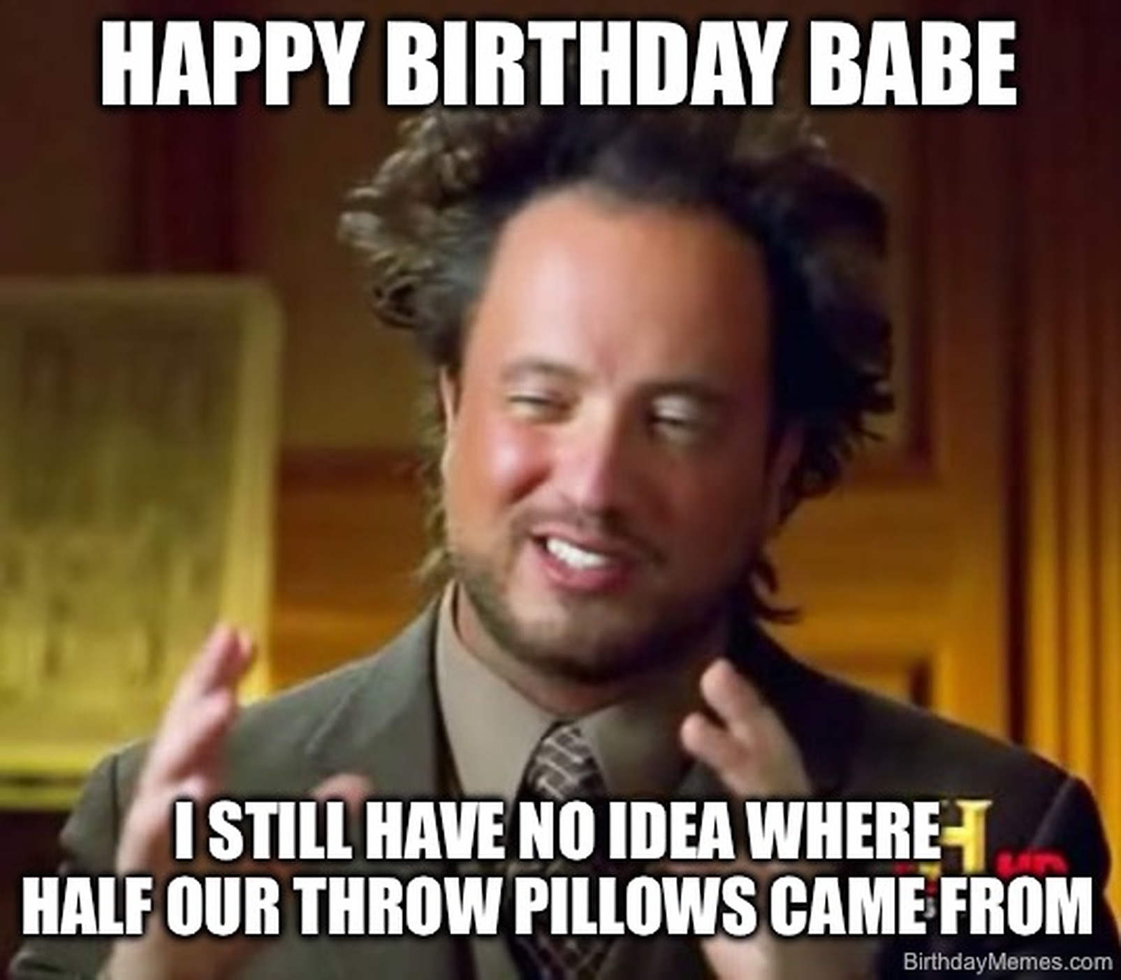 Man with wild hair gestures while text says, 'Happy birthday babe. I still have no idea where half our throw pillows came from.'