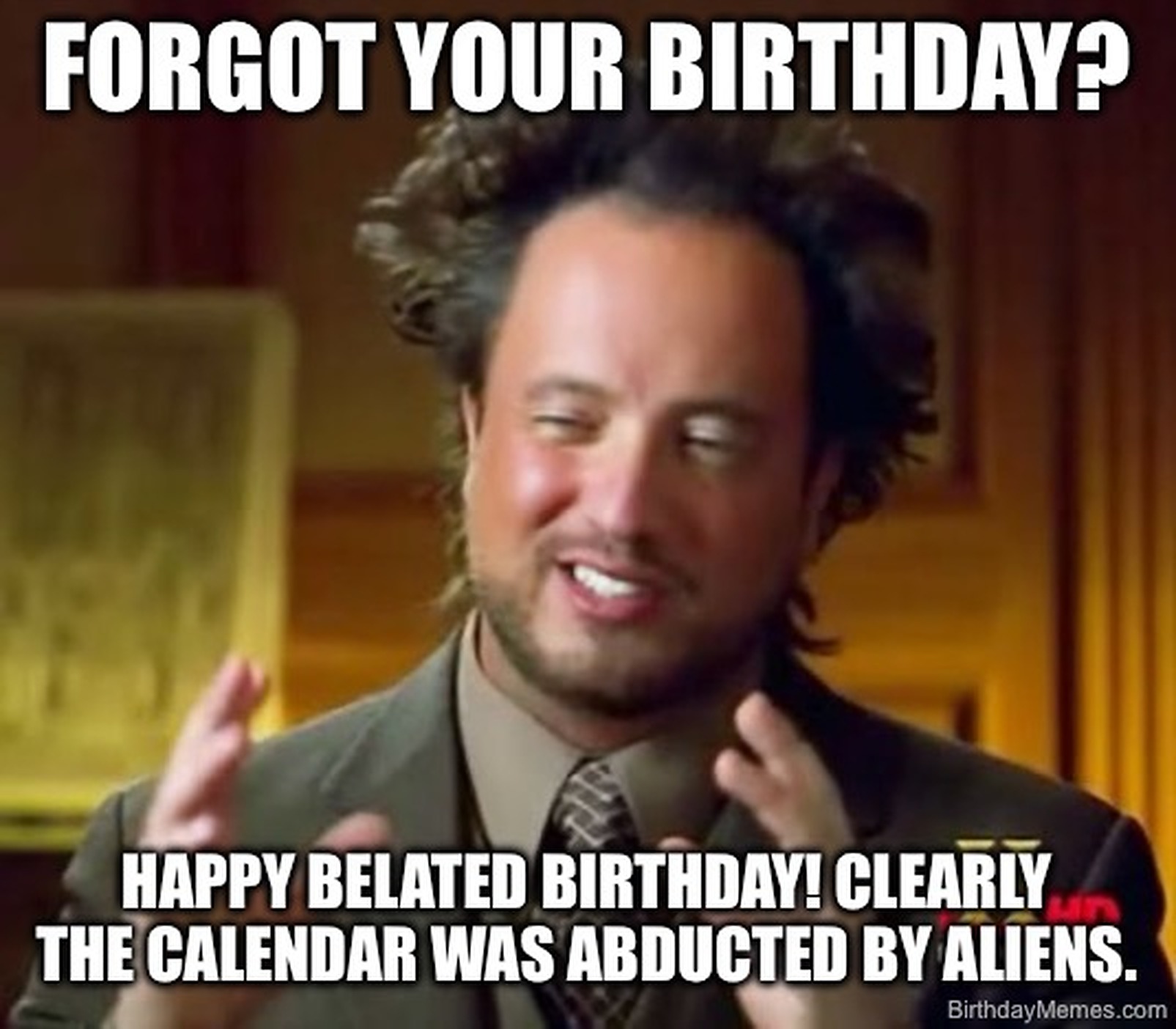 A man with wild hair gestures, saying he forgot your birthday because aliens abducted the calendar.