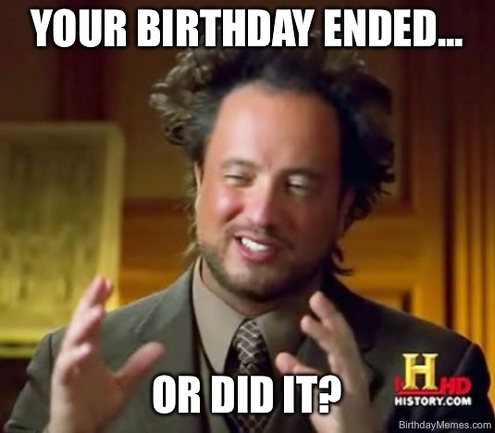 Man with wild hair and suit gestures, text reads: 'Your birthday ended... or did it?'
